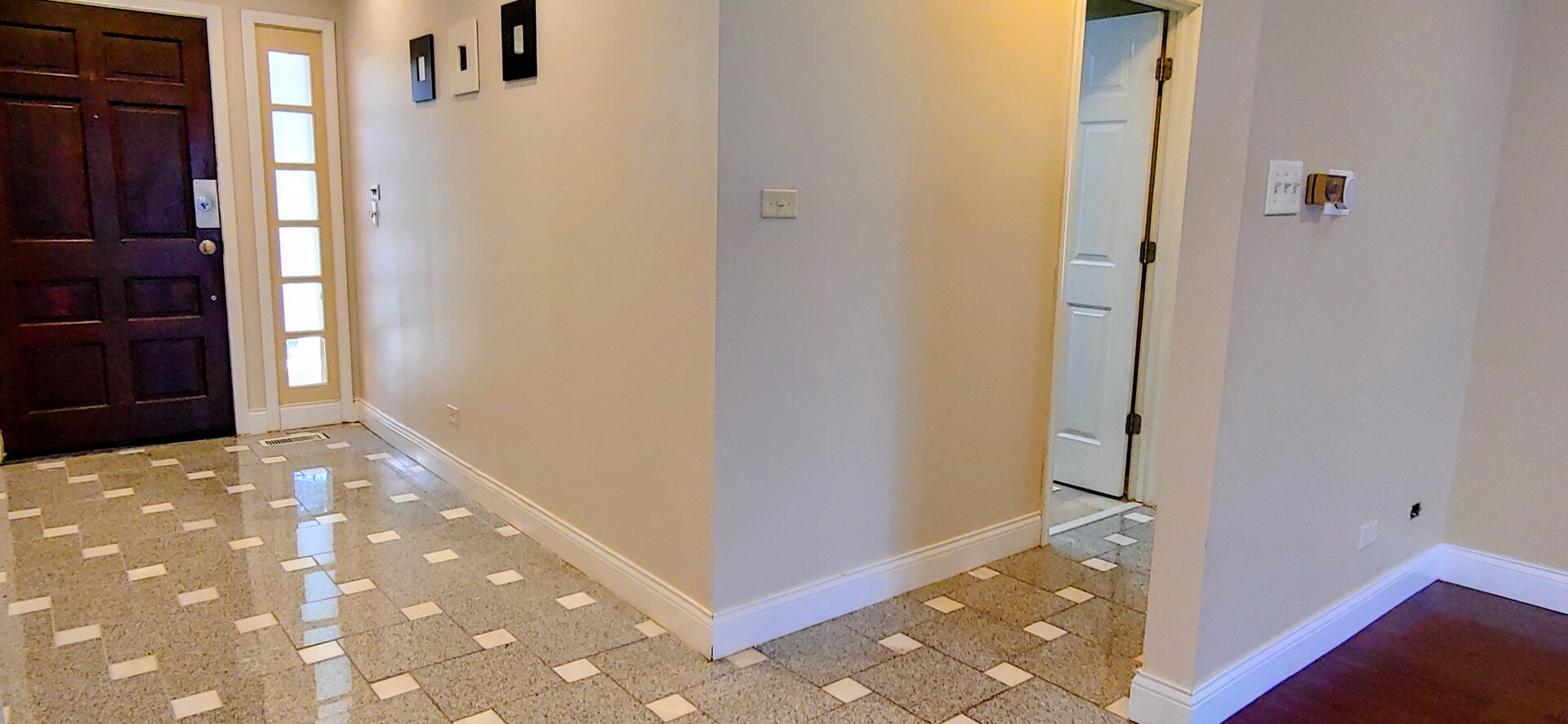 1160 Hassell Road Hoffman Estates, IL 60169 - Photo 21 of 24 a view of a hallway with wooden floor and cabinet