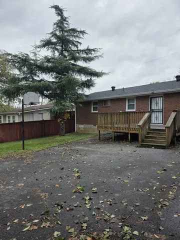 a view of a house with a back yard