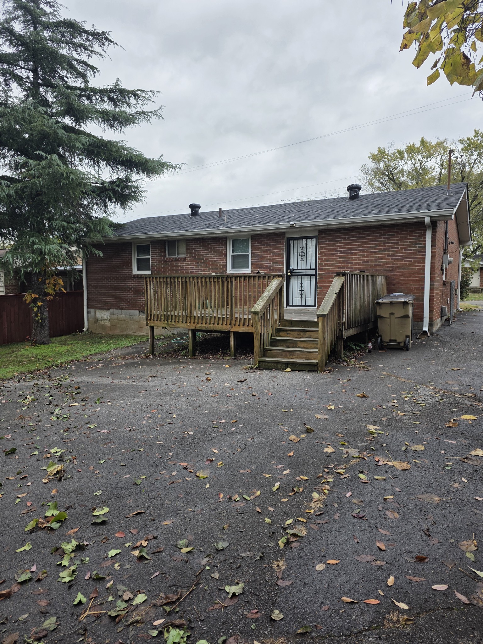 226 Becklea Drive Madison, TN 37115 - Photo 6 of 20 a view of a house with a yard and parking space