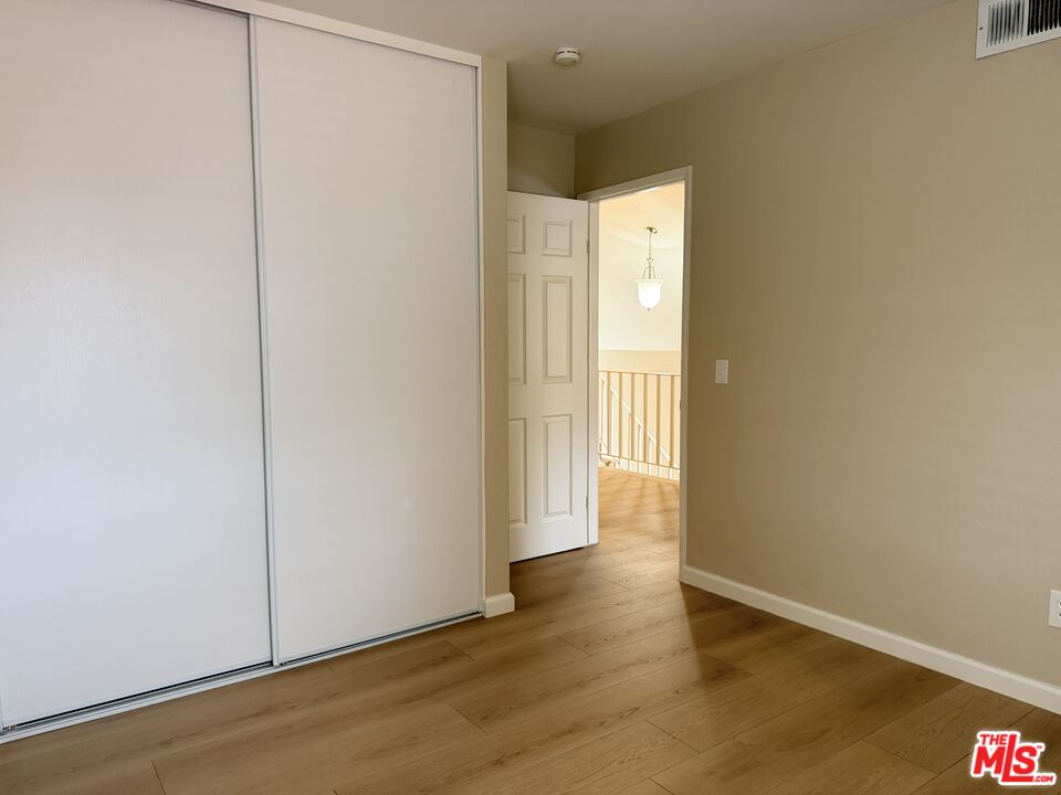 13099 Reindeer Court Riverside, CA 92503 - Photo 18 of 24 a view of an empty room with wooden floor