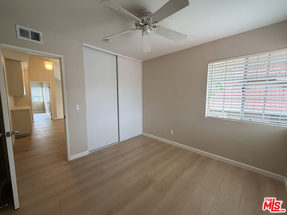 13099 Reindeer Court Riverside, CA 92503 - Photo 20 of 24 wooden floor in an empty room with a window