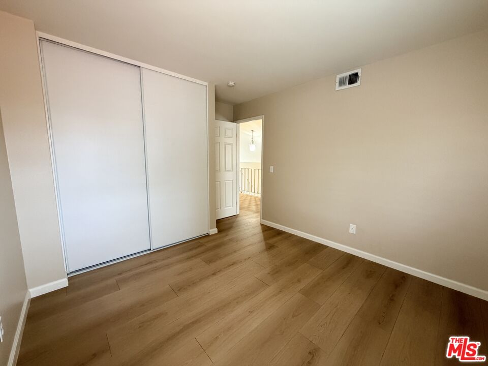 13099 Reindeer Court Riverside, CA 92503 - Photo 22 of 24 a view of an empty room with wooden floor