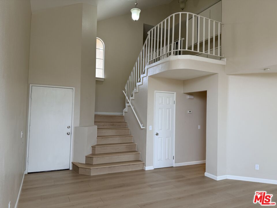 13099 Reindeer Court Riverside, CA 92503 - Photo 3 of 24 a view of entryway with wooden floor