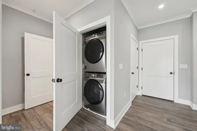 a view of a hallway with washer and dryer