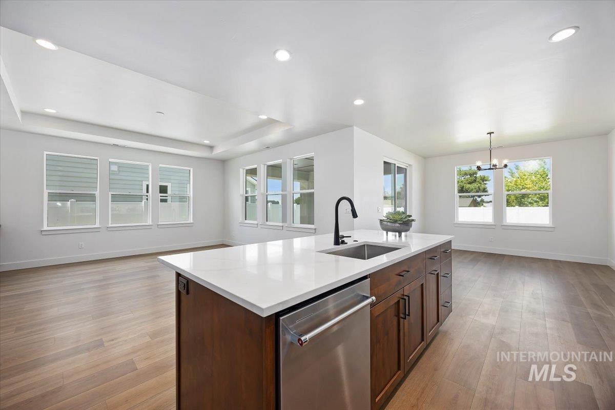 258 Maxine Lane, Unit HOMESITE 207 Kimberly, ID 83341 - Photo 19 of 19 Kitchen with dishwasher, recessed lighting, open floor plan, light wood-style flooring, and decorative light fixtures