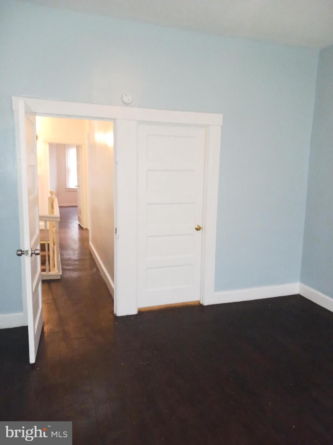 1708 Normal Avenue Baltimore, MD 21213 - Photo 13 of 14 an empty room with wooden floor