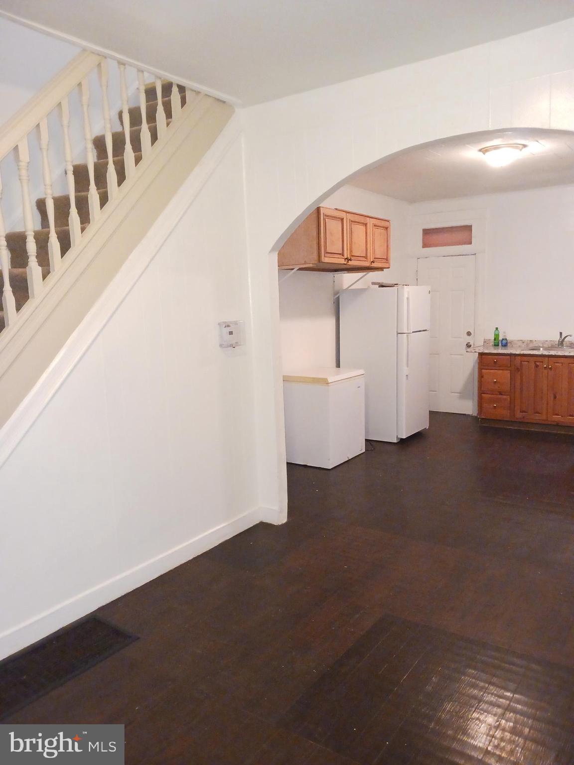 1708 Normal Avenue Baltimore, MD 21213 - Photo 7 of 14 a view of an empty room with stair