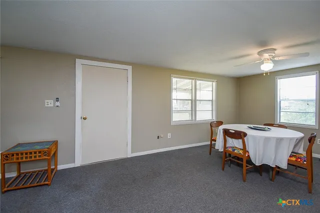 a bed room with furniture and a window