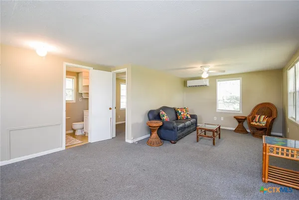 a living room with furniture and a window