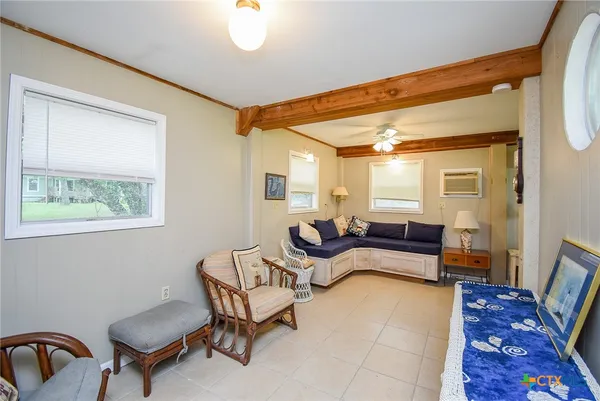 a living room with furniture and a rug