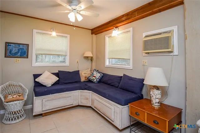 a living room with furniture and a window