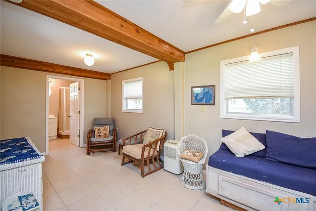 a living room with furniture and a window