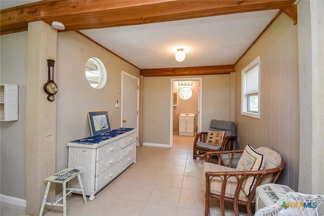 a view of a livingroom with furniture and windows