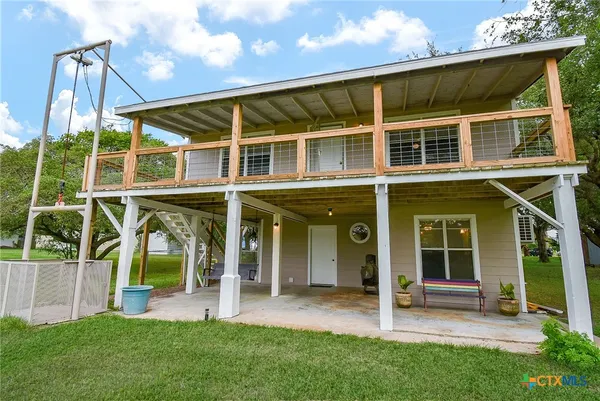 a view of an house with backyard porch and sitting area