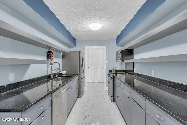 860 Lower Ferry Road, Unit 1K Ewing, NJ 08628 - Photo 14 of 49 a kitchen with a sink and cabinets