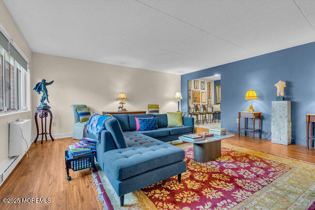 860 Lower Ferry Road, Unit 1K Ewing, NJ 08628 - Photo 25 of 49 a living room with furniture a rug and a table
