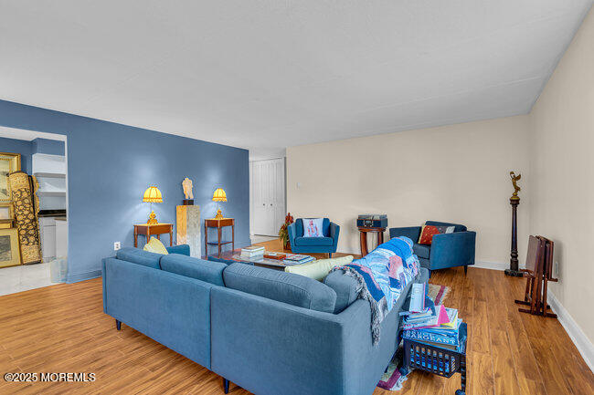860 Lower Ferry Road, Unit 1K Ewing, NJ 08628 - Photo 26 of 49 a living room with furniture and wooden floor