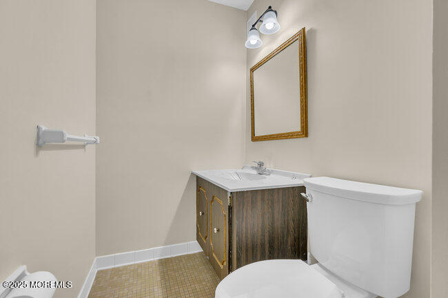 860 Lower Ferry Road, Unit 1K Ewing, NJ 08628 - Photo 28 of 49 a bathroom with a toilet a sink and mirror