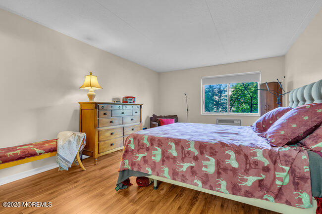 860 Lower Ferry Road, Unit 1K Ewing, NJ 08628 - Photo 30 of 49 a bedroom with a bed and a window