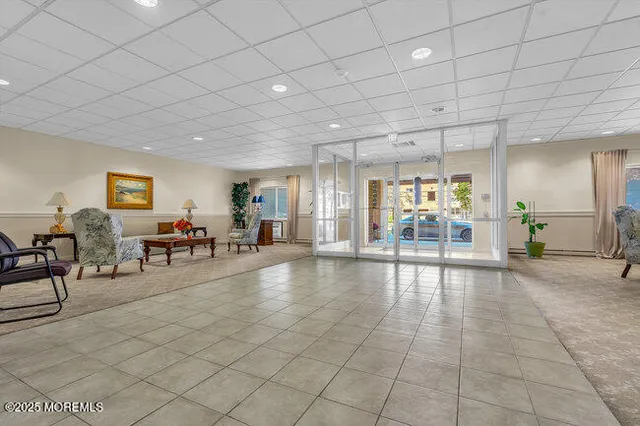 a view of a livingroom with furniture and a stove