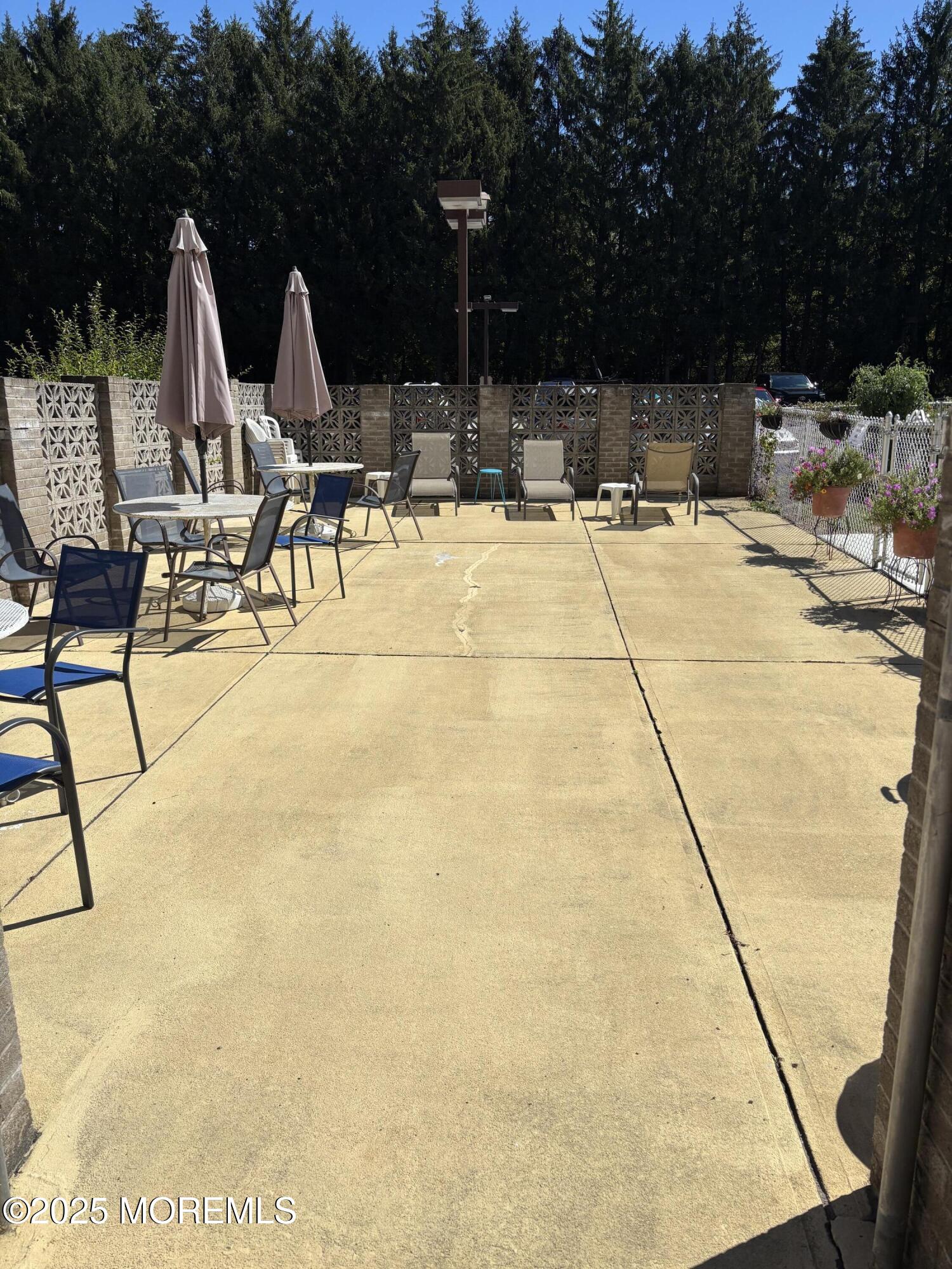 860 Lower Ferry Road, Unit 1K Ewing, NJ 08628 - Photo 44 of 49 a view of swimming pool with outdoor seating
