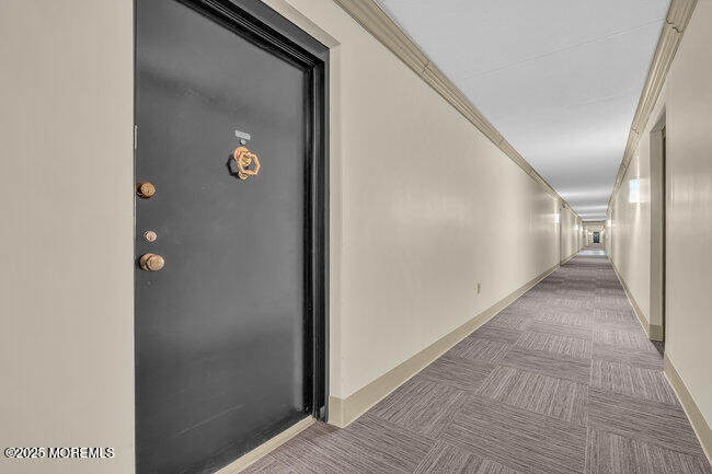 860 Lower Ferry Road, Unit 1K Ewing, NJ 08628 - Photo 7 of 49 a view of a hallway with wooden floor