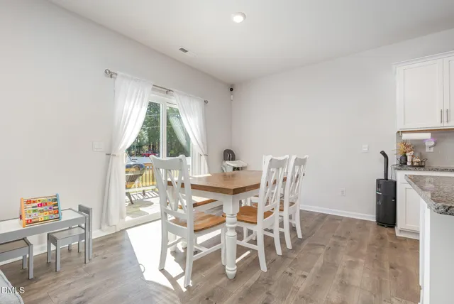 a view of a dining room with furniture window and outside view