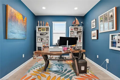 a dining room with furniture a rug and a chandelier