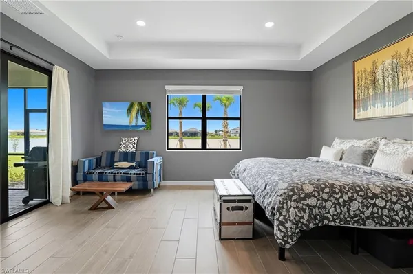 a living room with furniture and flat screen tv