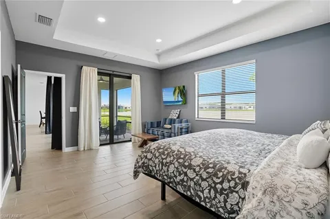 a bedroom with a bed and a couch