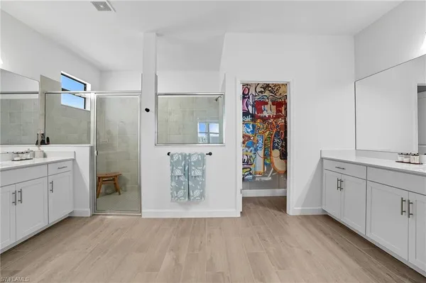 a bedroom with a large bed and a large window