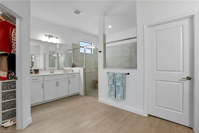 a view of a storage & utility room with closet dryer