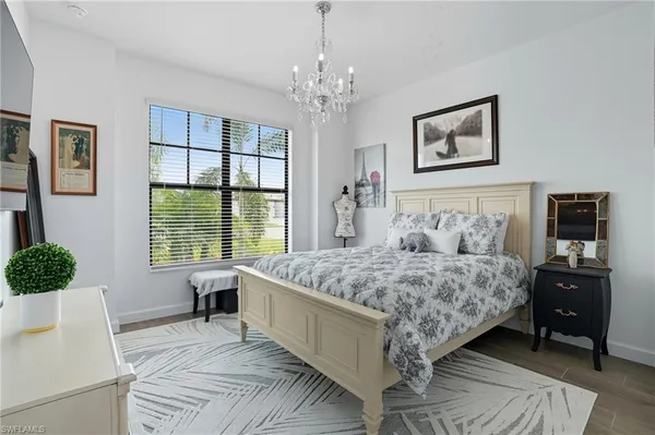 a bathroom with a double vanity sink mirror and shower