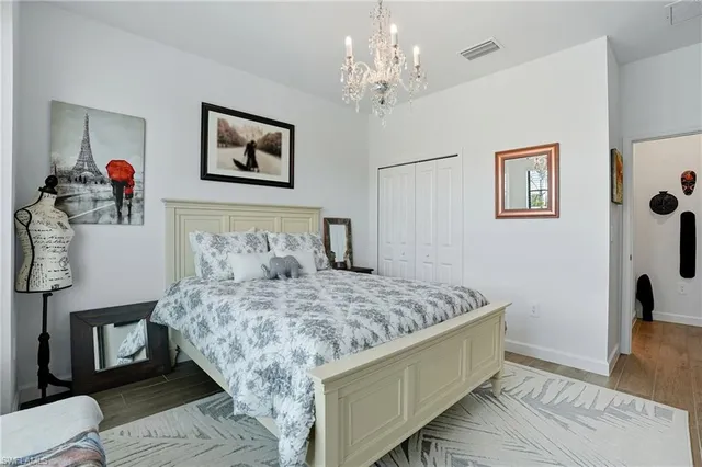 a bedroom with a large bed and a window