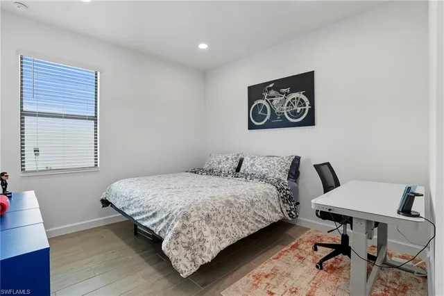 a bathroom with a sink vanity granite toilet and shower