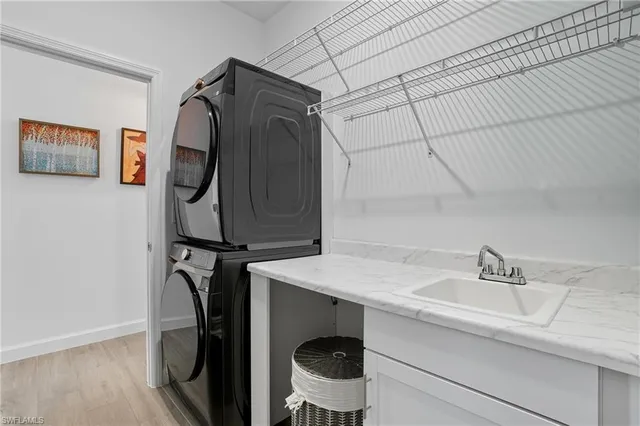 a bathroom with a toilet sink vanity and mirror
