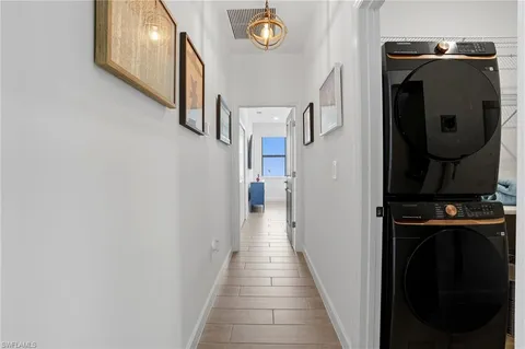 a view of a hallway with washer and dryer