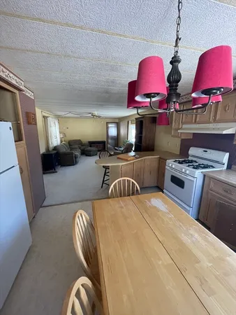 a bedroom with furniture and a flat screen tv