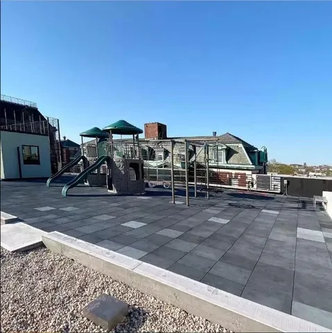 a terrace of a house with outdoor seating
