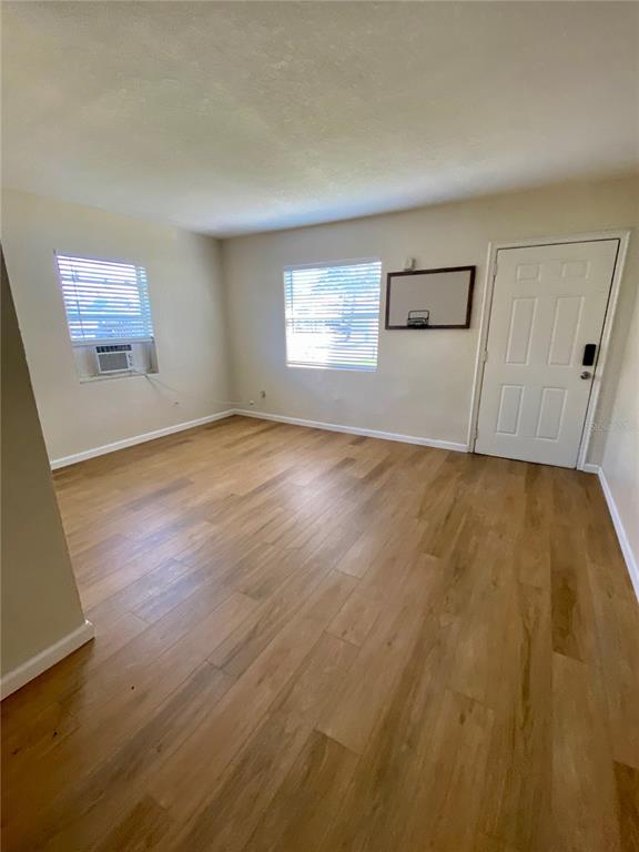 3722 28th Street North, Unit B St. Petersburg, FL 33713 - Photo 4 of 8 a view of empty room with wooden floor