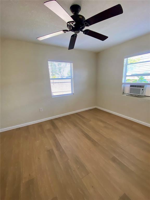 3722 28th Street North, Unit B St. Petersburg, FL 33713 - Photo 6 of 8 an empty room with a window and a fan