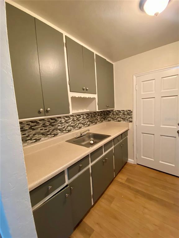 3722 28th Street North, Unit B St. Petersburg, FL 33713 - Photo 7 of 8 a kitchen with a stove and a refrigerator
