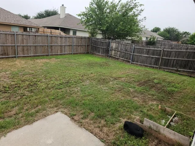 a view of a backyard with a small pool