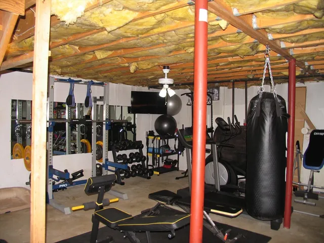 a view of gym equipment and cars parked on road