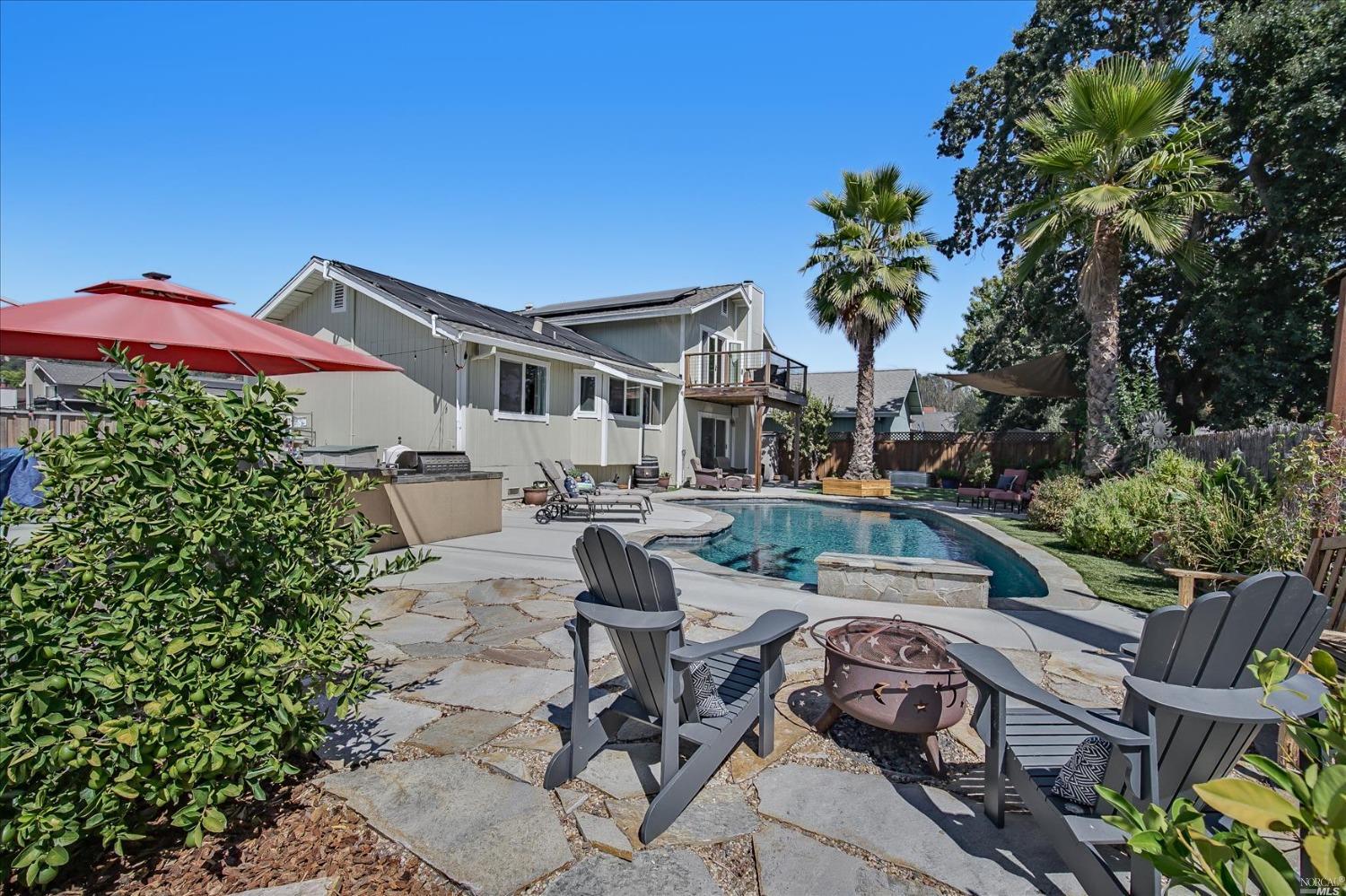 5757 Carriage Lane Santa Rosa, CA 95403 - Photo 1 of 1 a view of a patio with table and chairs potted plants with wooden fence