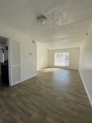 a white toilet sitting next to a sink