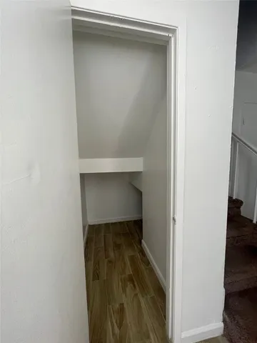 a living room with furniture and stairs