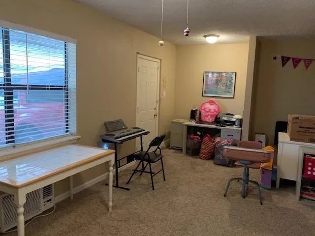 a view of a workspace with furniture