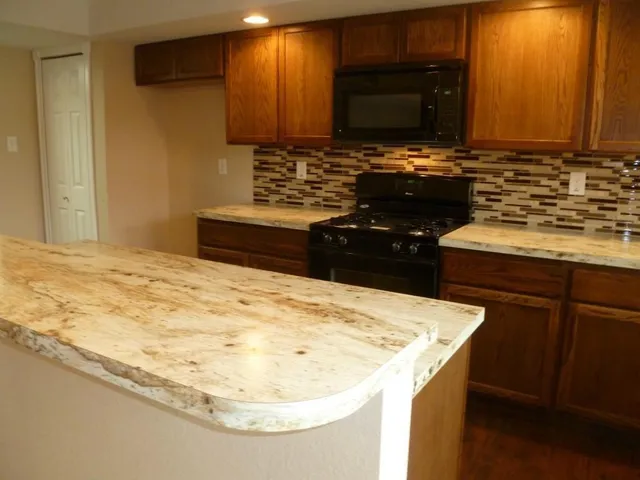 a kitchen with a sink and a stove
