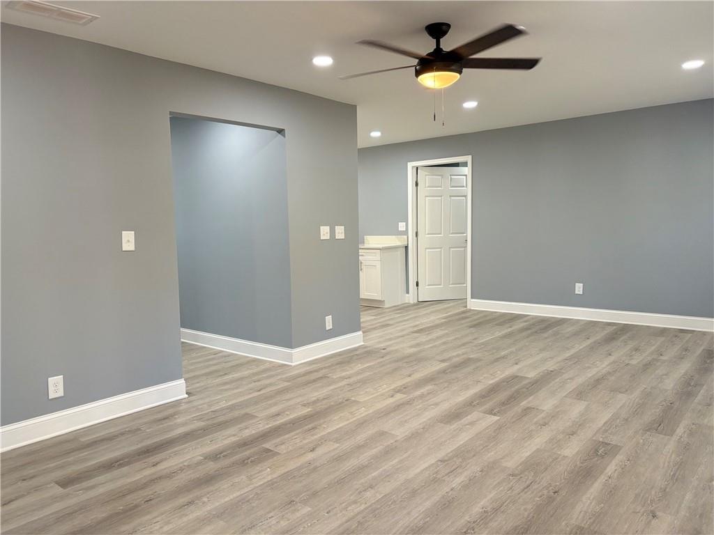 1546 Alverado Way Decatur, GA 30032 - Photo 2 of 17 wooden floor in an empty room with a window